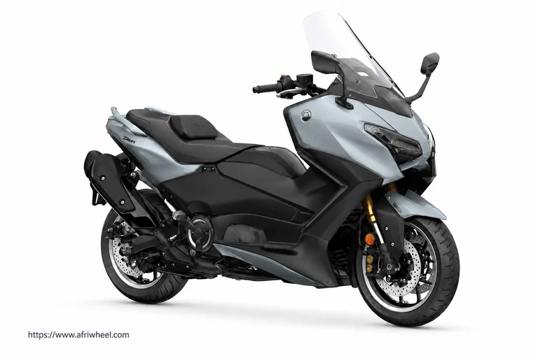 T-MAX 560 in Grey, front three-quarter view with dual-eye headlights and tall windscreen